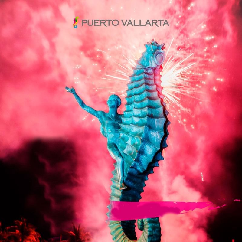 Statue against a pink fireworks backdrop at Villa Premiere Boutique Hotel & Romantic Getaway