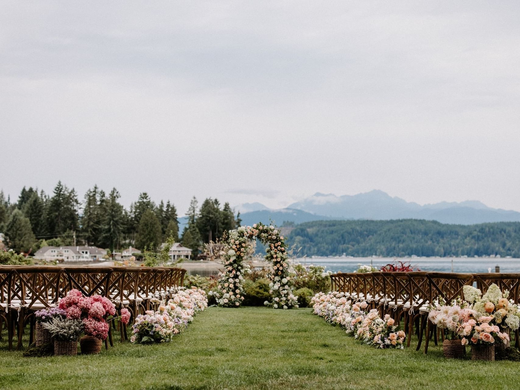 Wedding arrangements with floral decor in Waterfront Lawn at Alderbrook Resort & Spa