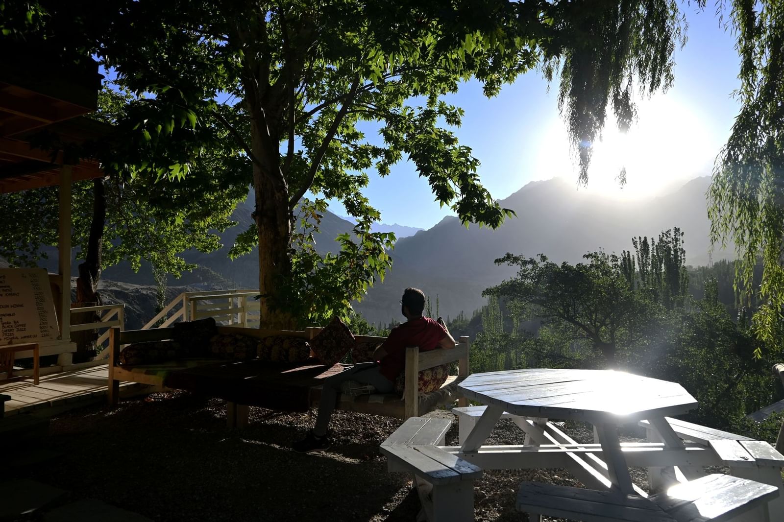 Man relaxing in outdoor area of Khabasi in Serena Altit Fort