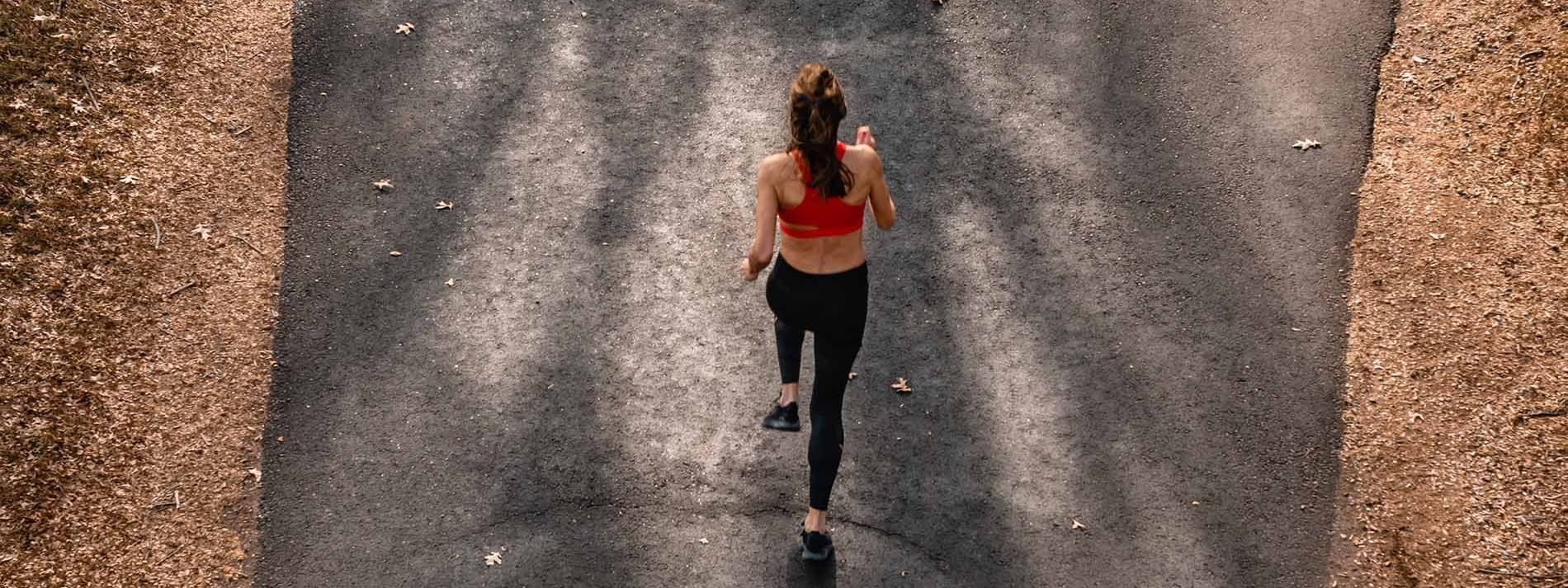 Aerial shot of a woman jogging near the Crown Hotels