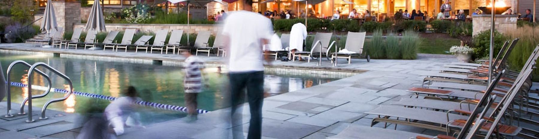 A family by the pool area at Topnotch Stowe Resort