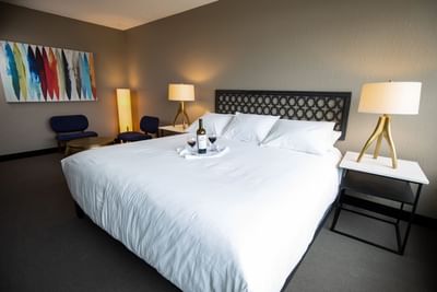 two glasses of wine on a bed