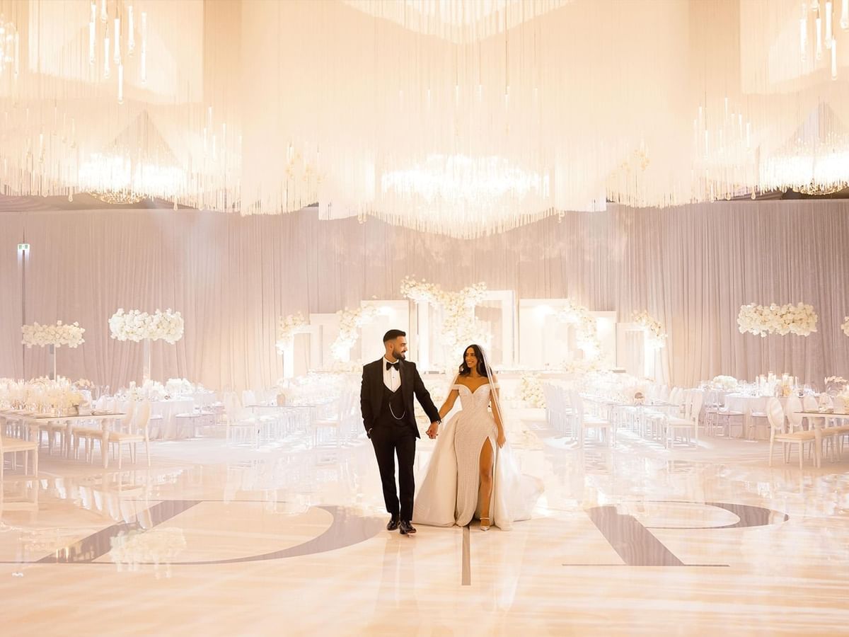 Going away of Paris and Daniel in a wedding hall with floral decor at Crown Towers Perth