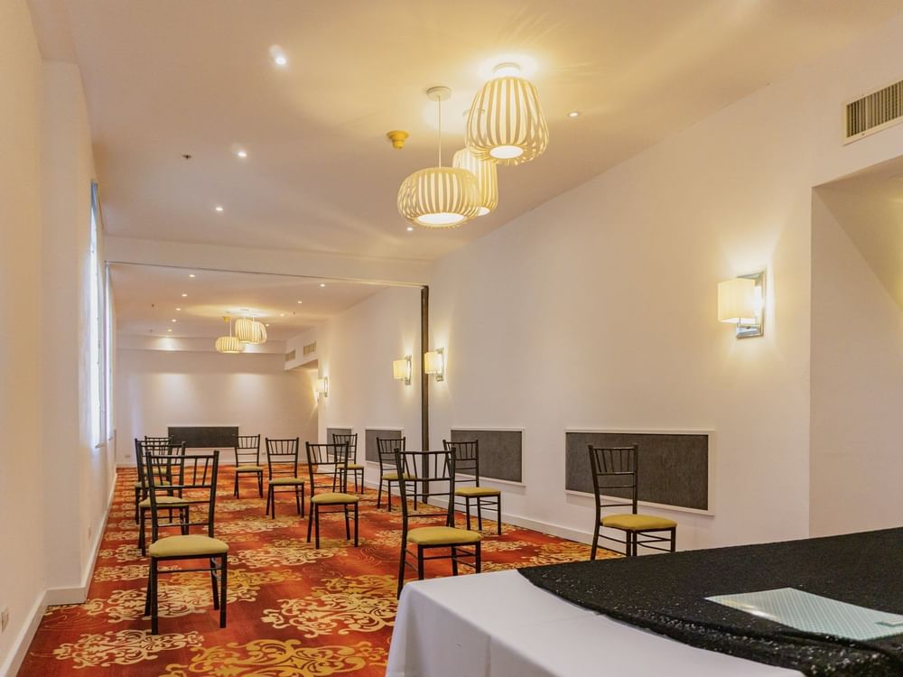 Close-up of chair arrangements in Rubi B Room at Gamma Hotels