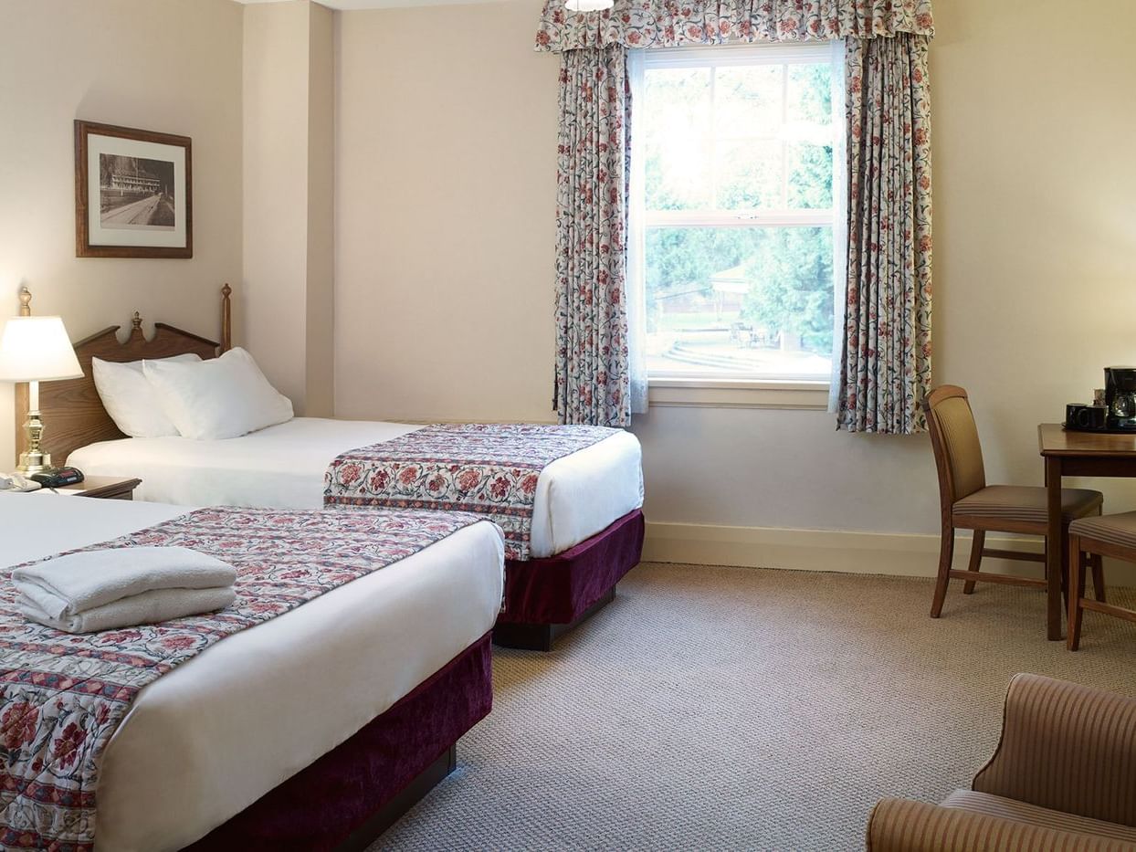 Heritage Building: Queen/Single with cozy beds at Harrison Hot Springs Resort