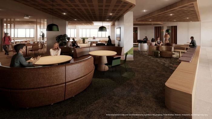Modern shared lounge area with seating and tables at UniLodge Brisbane City in Brisbane City.