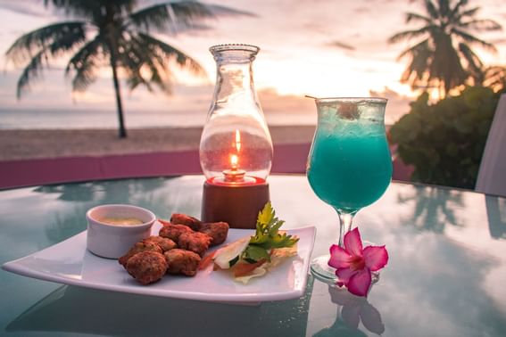 A cocktail served with snacks at Southern Palms Beach Club