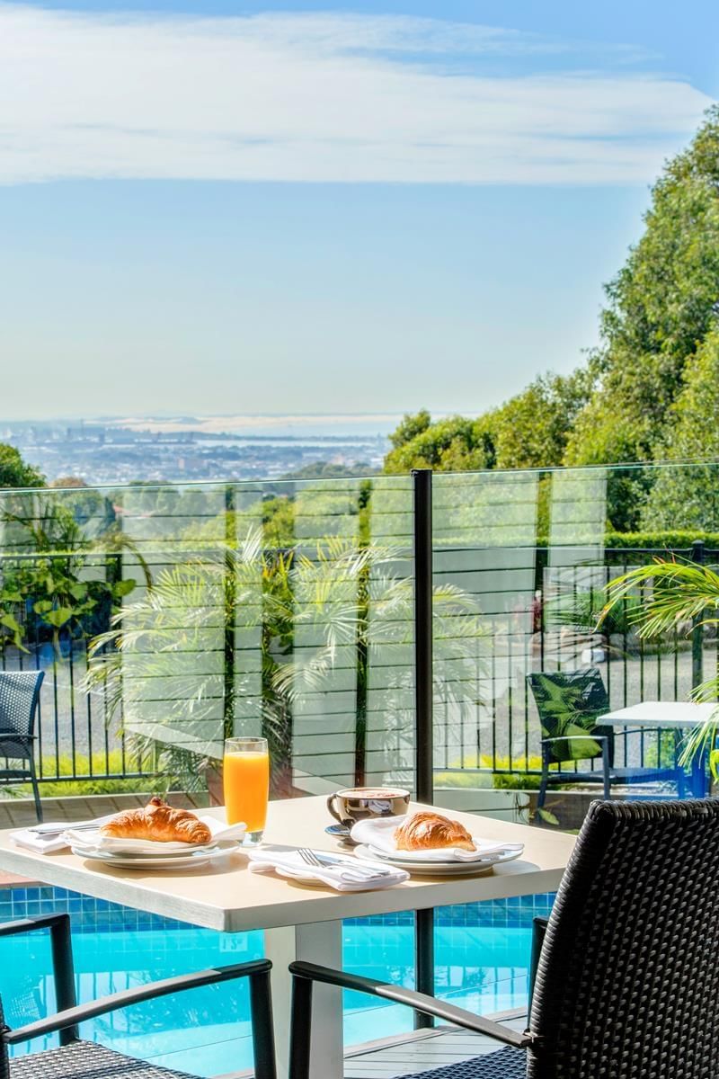Dining area near the pool at Mercure Charlestown 