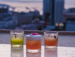 Rooftop bars with live DJ on Taranaki Street near James Cook Hotel Grand Chancellor