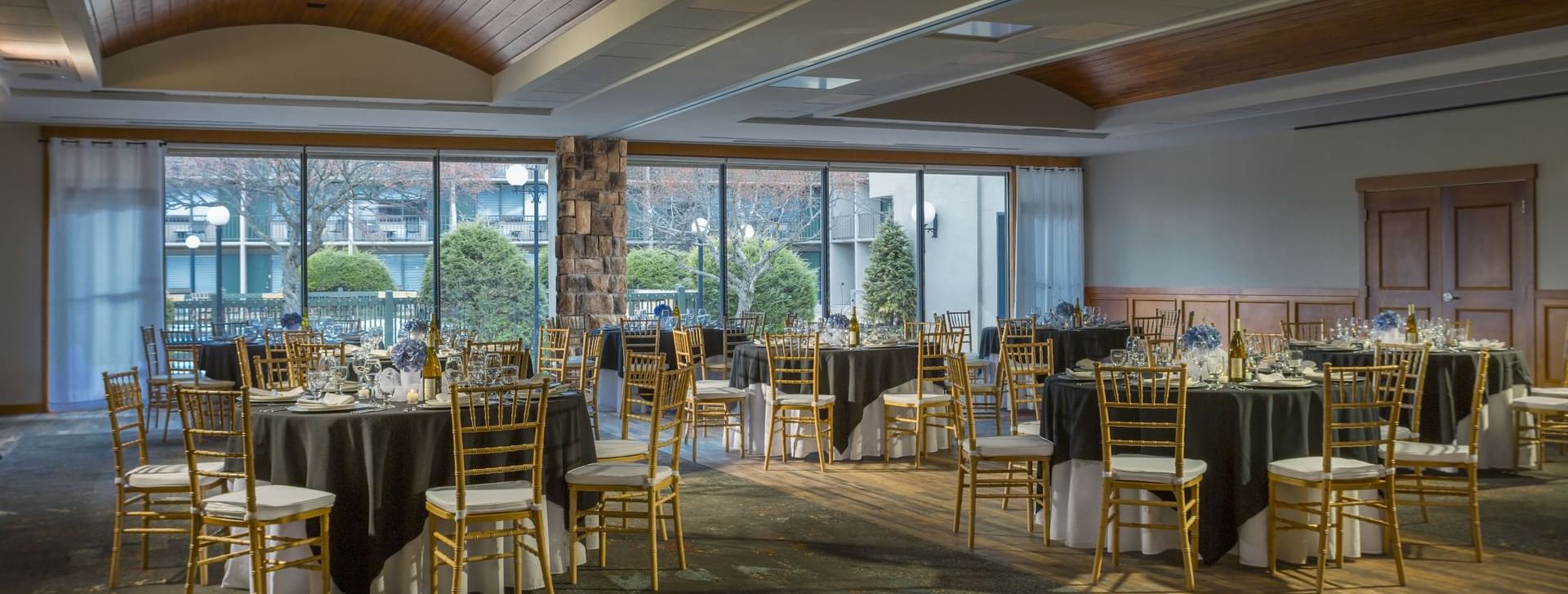 Banquet tables arranged with chairs for a wedding event in Wedding in Great Range at High Peaks Resort