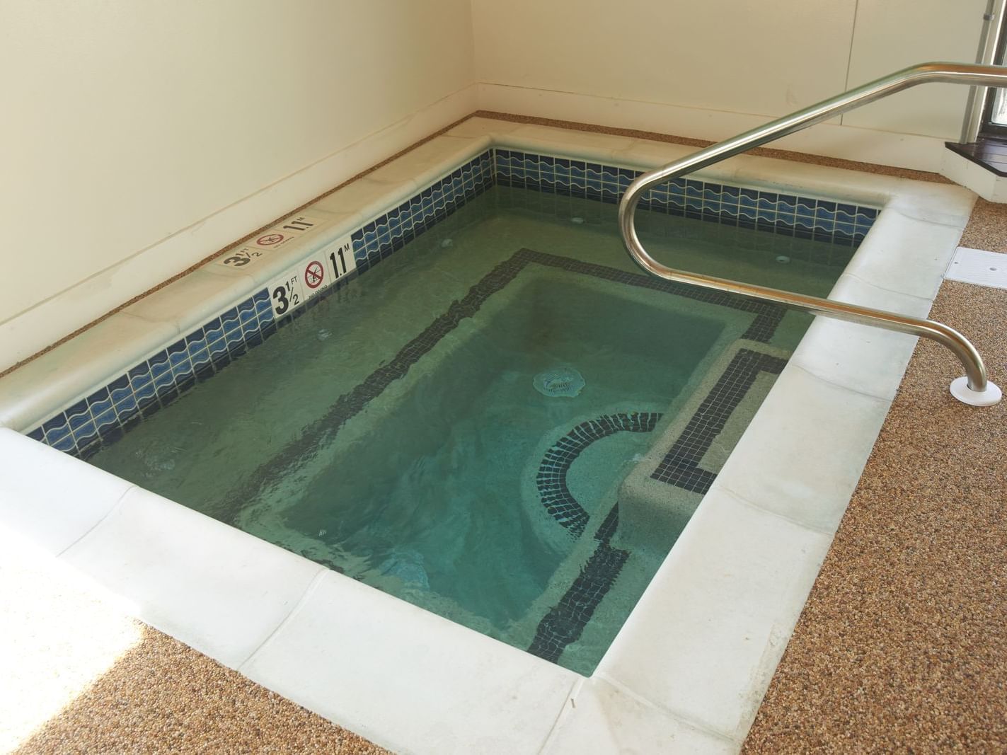 Hot Tub Next To Indoor Pool