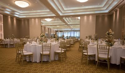 Banquet tables arranged in a Hall for an event at Ajman Hotel