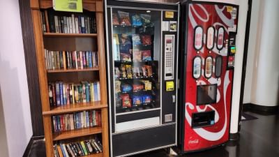Bookshelf by vending machines at Stay Hotel Waikiki