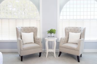 Two wing chairs in Premiere Loft Town & Country at Retro Suites