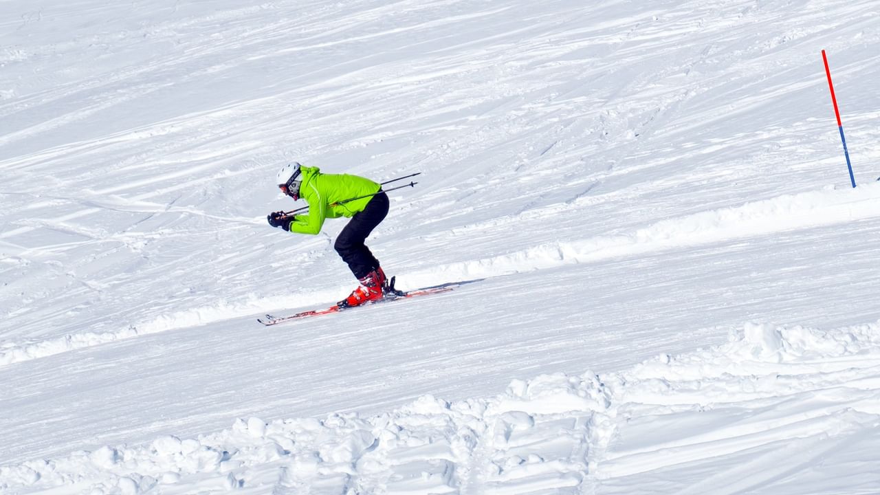 skier in yellow jacket
