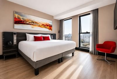 Superior Room featuring a plush king bed and artwork highlighting places to stay in Valparaiso Chile at Veranda Hotel