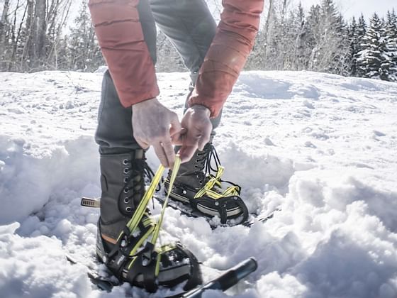 A man on snow shoes in the snow near Hotel Jackson