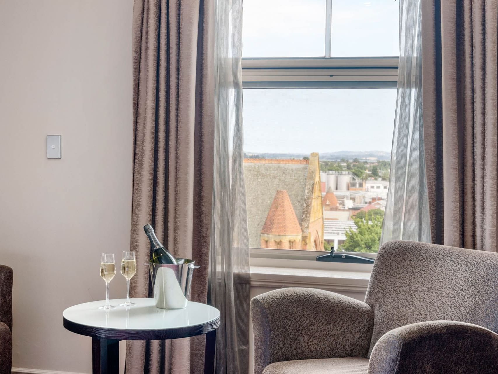 Champaign served by a window lounge in Executive Room at Grand Chancellor Launceston