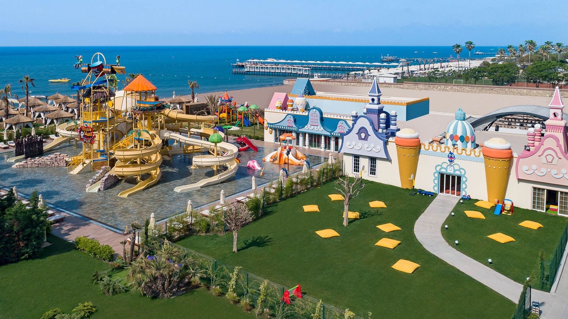 Aerial view of a playground with slides in Tini Kids Club at Titanic Mardan Palace