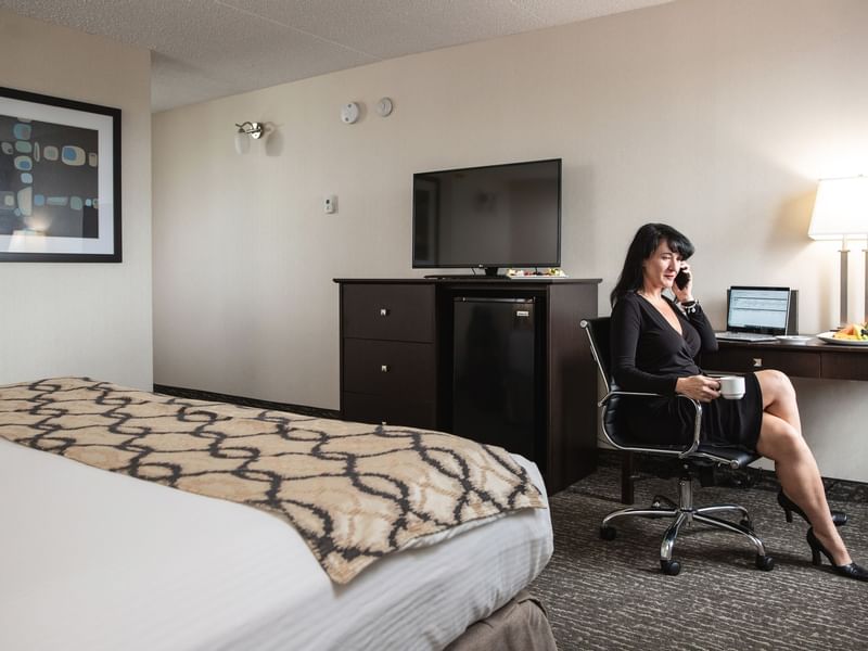 Businesswoman on phone in hotel room
