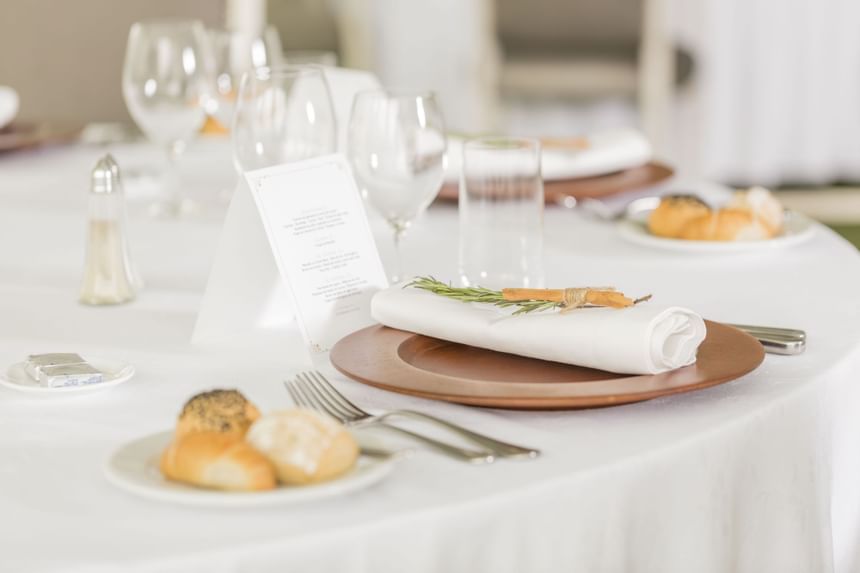 table set with bread for weddings