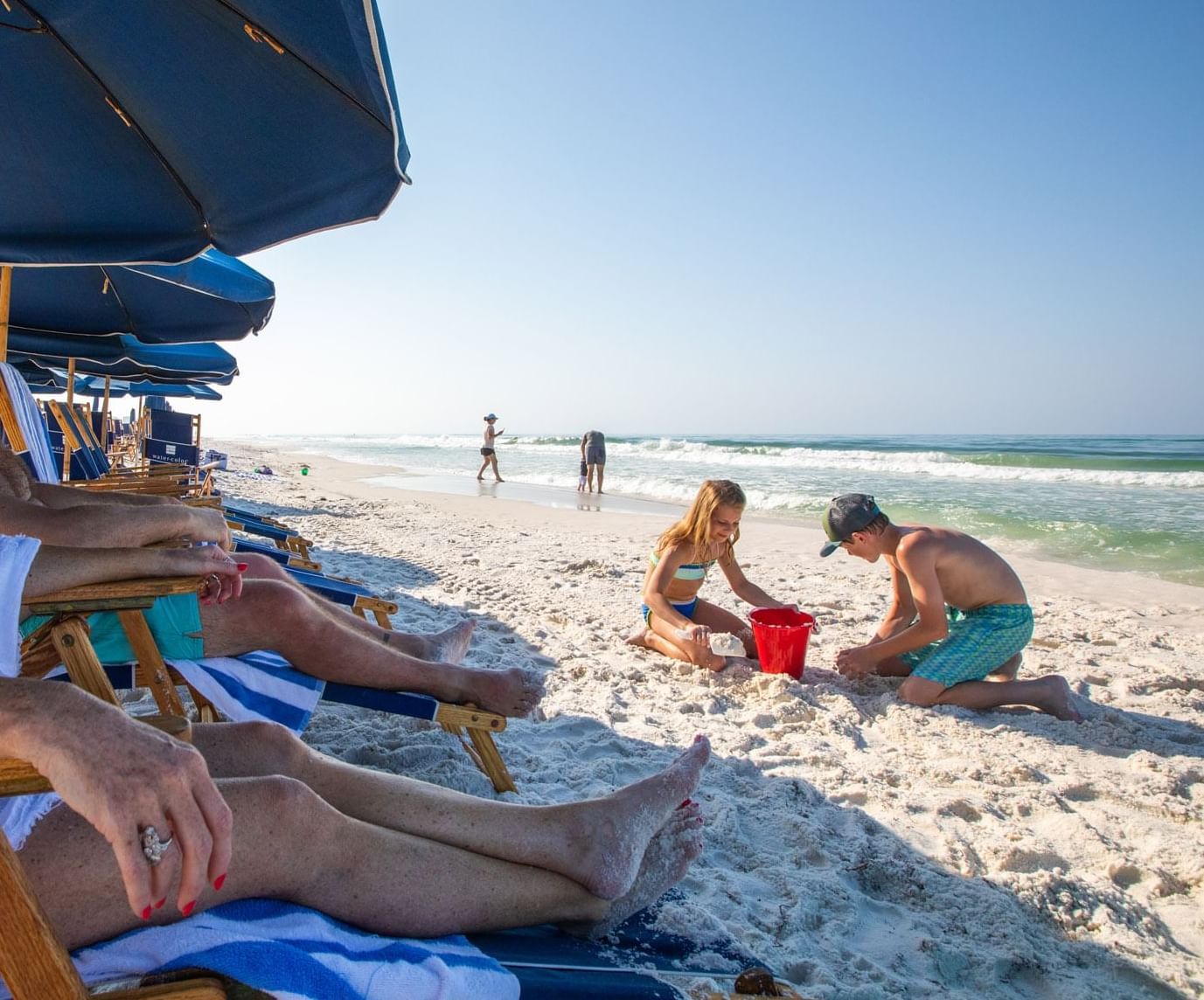 A family having fun on the beach at WaterColor Inn & Resort