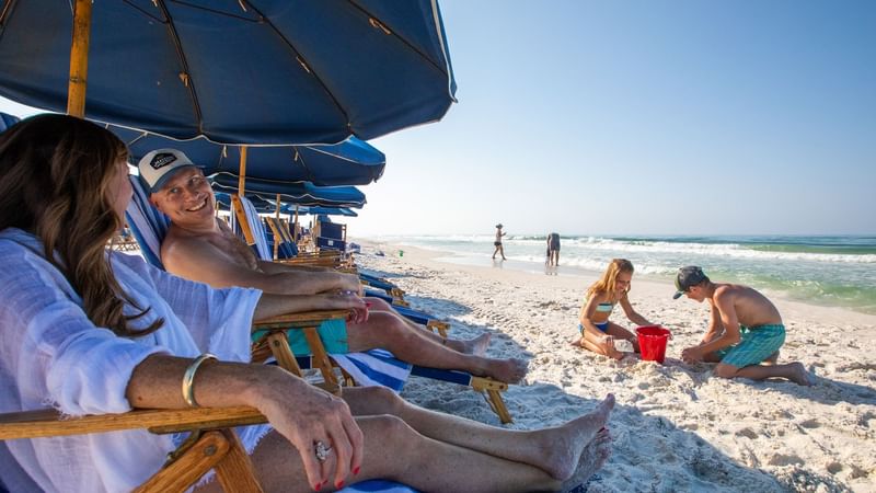 A family having fun on the beach at WaterColor Inn