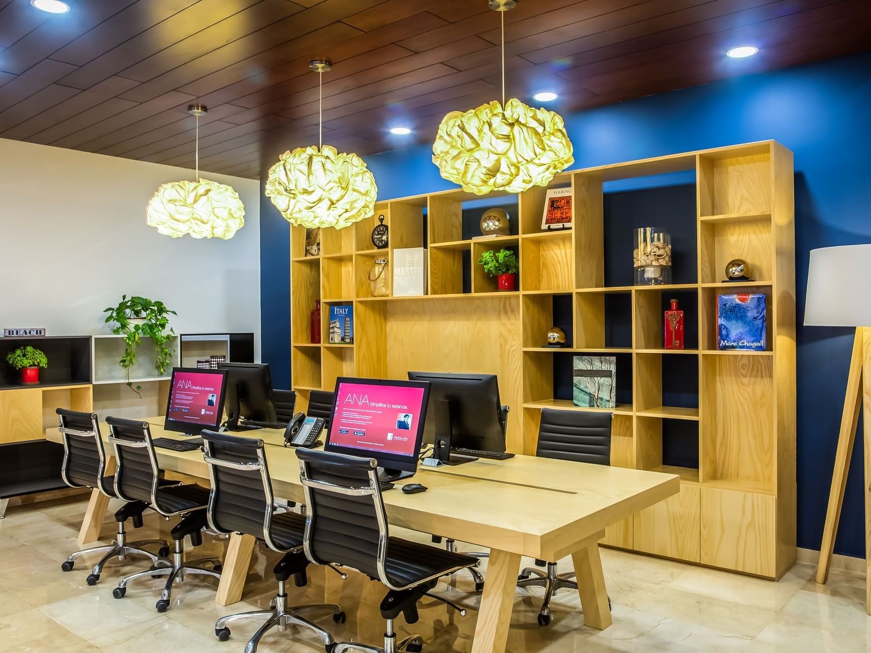 Closeup of computers & furniture in meeting room at Fiesta Inn