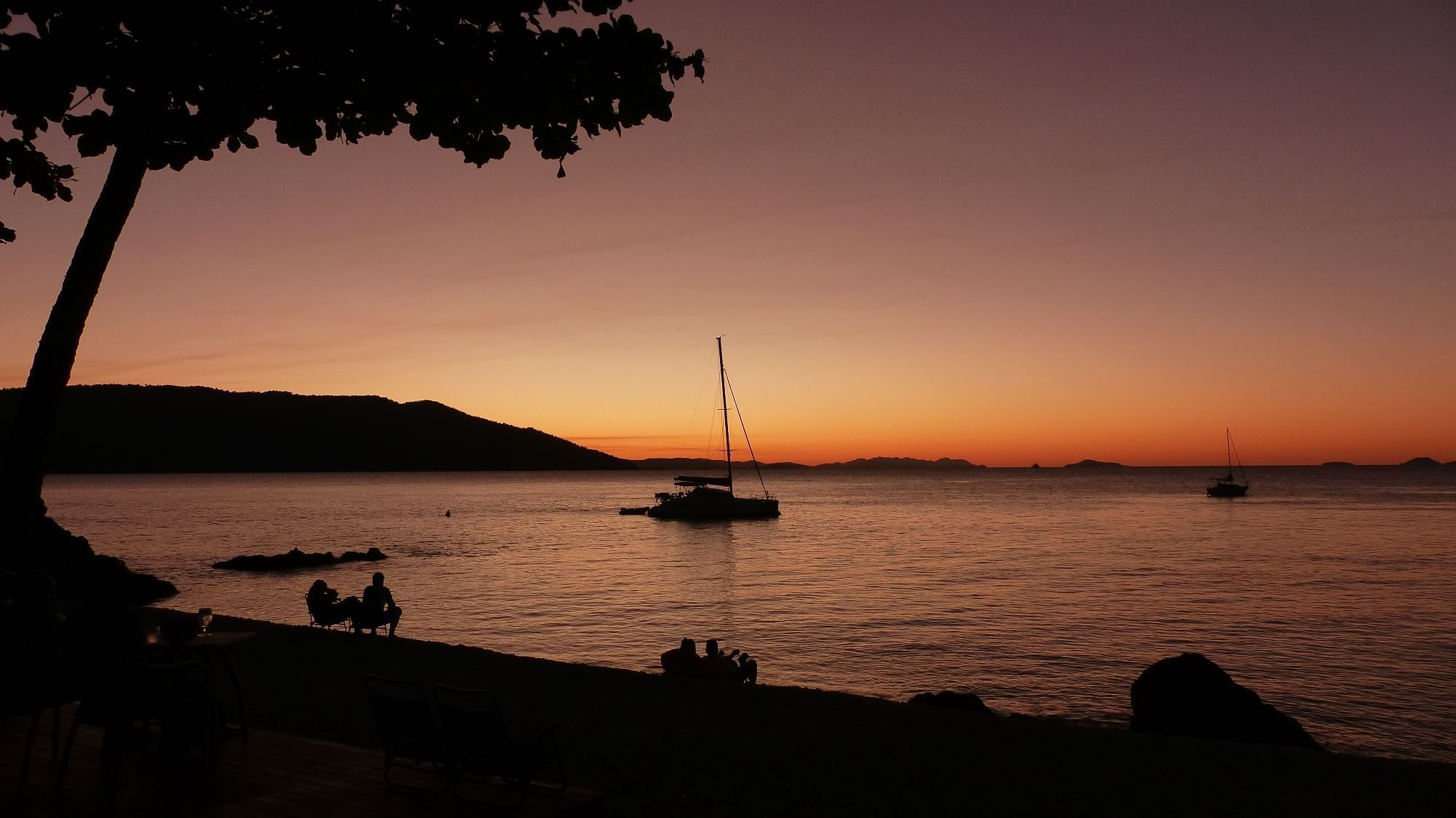 Evening view of a yacht on the sea near Daydream Island Resort