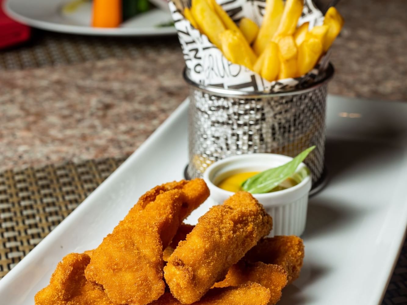 Fish & chips served on a table in the Lobby Bar at Playa Blanca Beach Resort