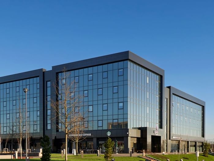 A distant exterior view of the hotel at Village Hotels