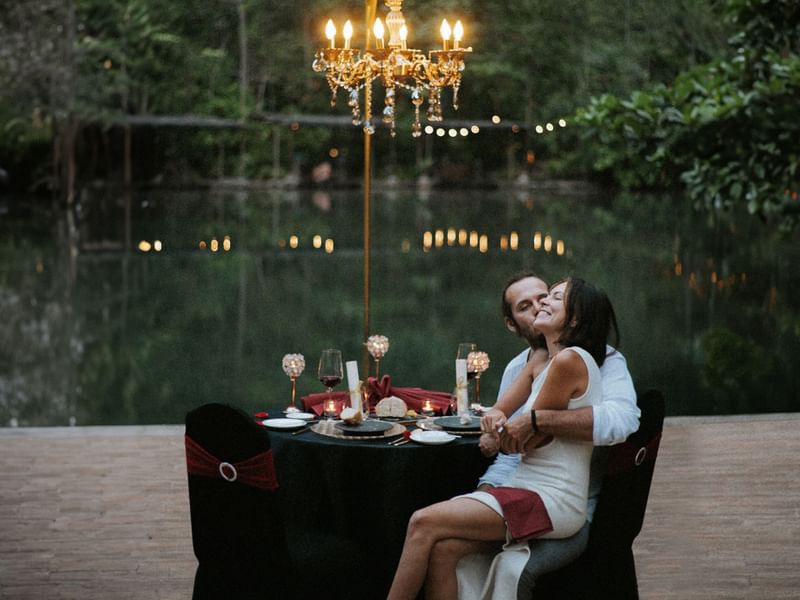 Couple enjoying dinner on the Star Deck at The Banjaran Hotsprings Retreat