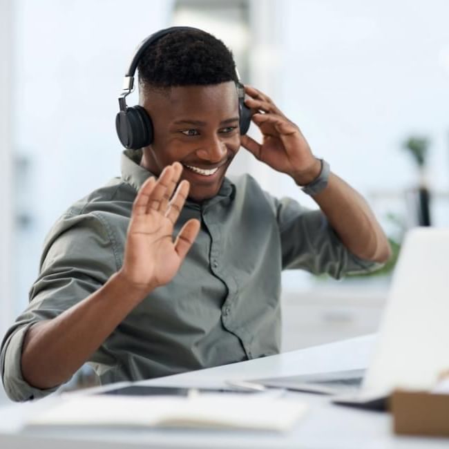 Man having a virtual meeting featuring our article on 