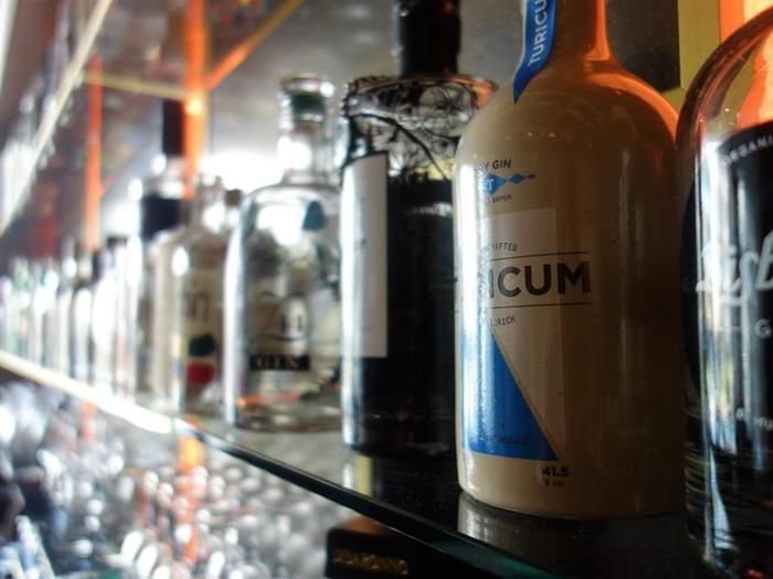 Close-up of bottles of Gin on a rack in a bar at Hotel Sternen