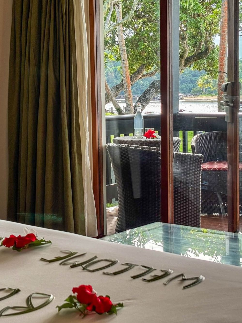 Studio Villa bedroom with ocean view and private balcony at The Naviti Resort in Korolevu.