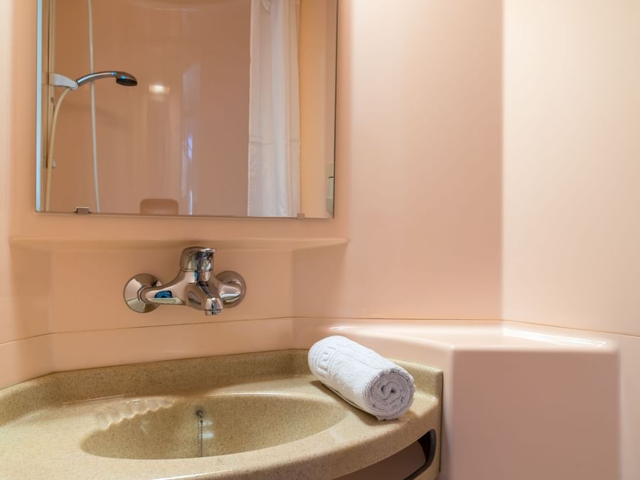 Bathroom vanity in bedrooms at Hotel Recouvrance