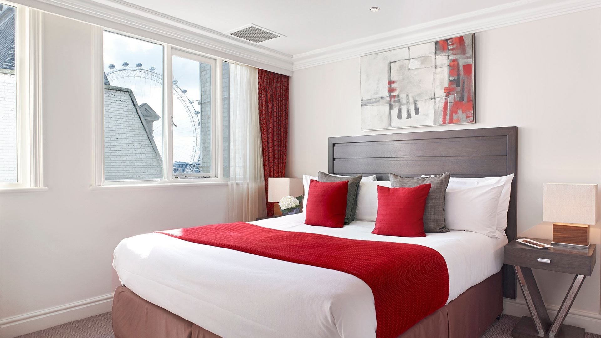 King bed & nightstand in Apartment Suite at Guoman Hotels