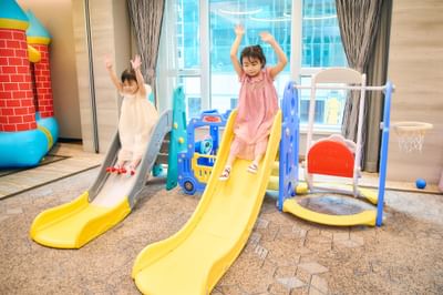 Children happily playing on the colorful slides at the parties held in Park Hotel Hong Kong
