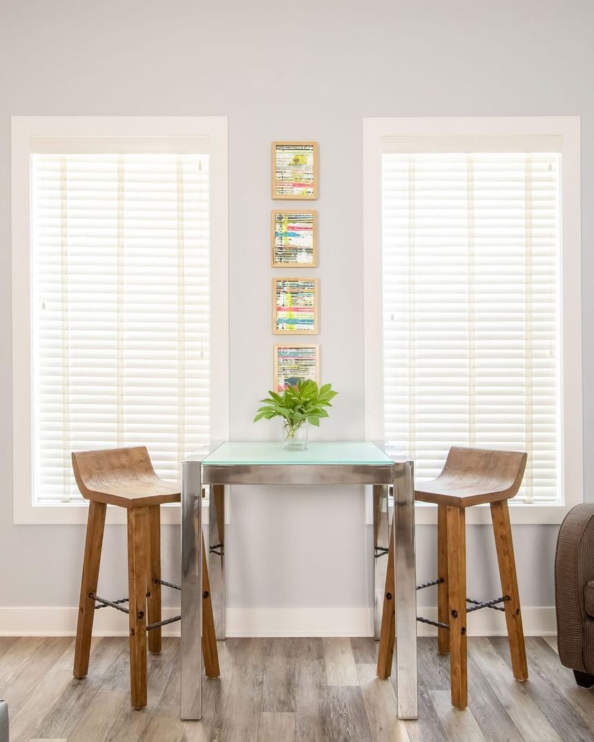 Dining set-up for two & paintings on the wall in Premiere Loft Town & Country at Retro Suites Hotel