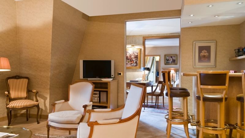 Lounge area with wooden furniture in Royal Suite at Warwick Brussels