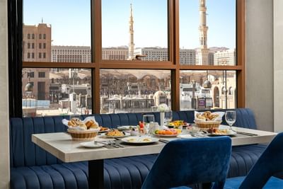 Dining table with a city view, Uhud Restaurant at Elaf Al Taqwa