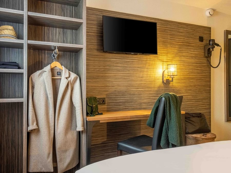Coat & towel in a room in Angers South at The Originals Hotels