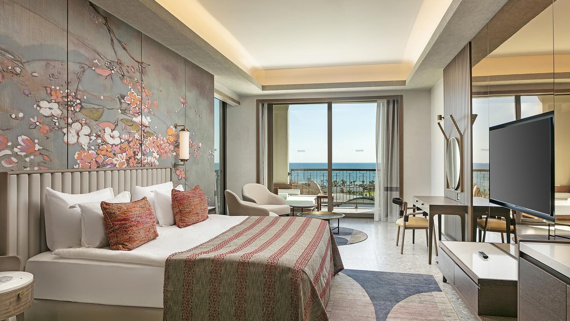 TV, seating area & work desk by the bed in Grand Family at Cullinan Belek