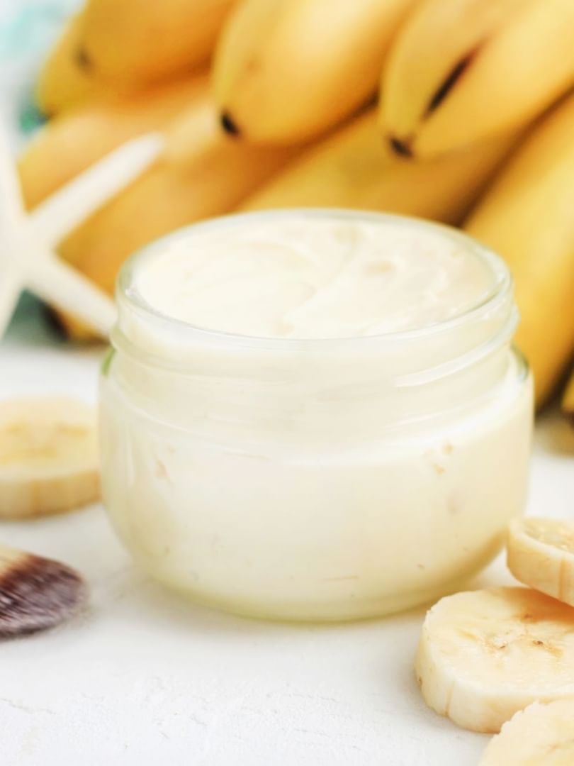 Cream in a jar by banana slices under a soft light surrounding a spa brush at Warwick Paradise Island Bahamas