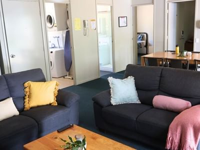 Cozy living area with two sofas and a coffee table at La Trobe University - Villas.