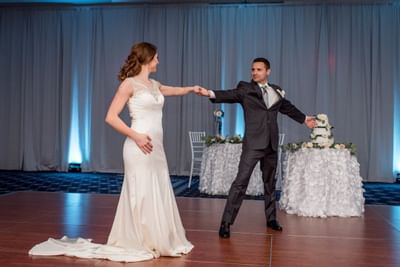 Portrait of a wedded couple dancing at UMass Lowell Inn