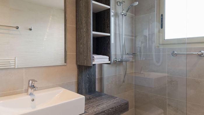 Bathroom vanity in bedrooms at Hotel Les Strelitzias