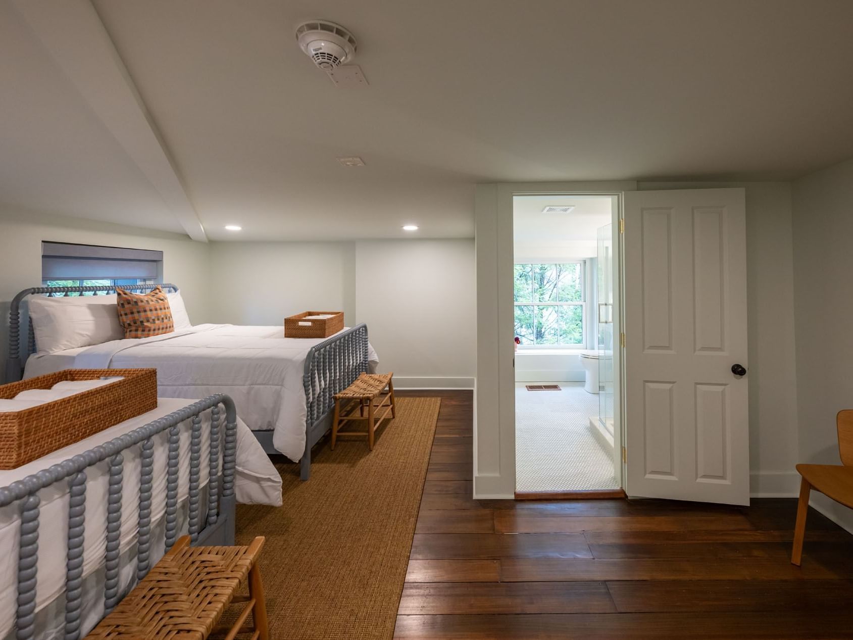 Classic Two Queen room with adjoining bathroom and wooden floor at The Ashbrook Hotel, featuring Frankfort Kentucky lodging.