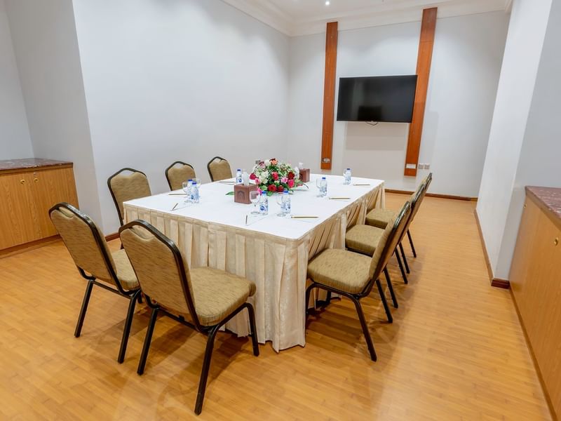 Boardroom table set-up with TV in Narcissus Room at Makeen Homes by Warwick - Riyadh