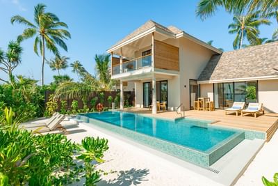 Lavish 2-Bedroom Beach Villas at Ananea Madivaru Maldives with a private pool, and tropical greenery under a clear blue sky